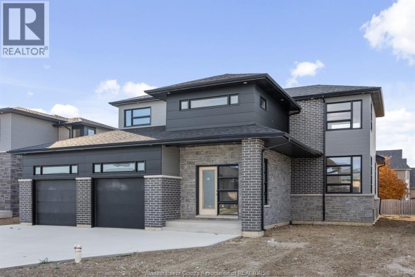 Close-up of the front entrance with large windows and modern architectural design. - 117 Hazel Crescent, Kingsville