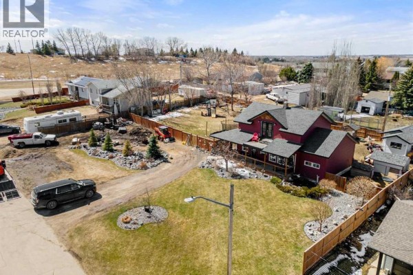 Aerial view of the property at 117 James Street showing the house and surrounding lot. - 117 James Street, Bittern Lake