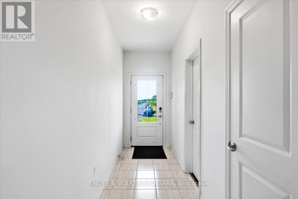 View of the kitchen with stainless steel appliances and dining area. - 117 Juneberry Road, Thorold