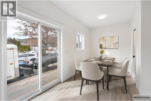 Dining area with table for four and sliding glass door to outdoor space - 11815 Grant Avenue Unit# 102, Summerland