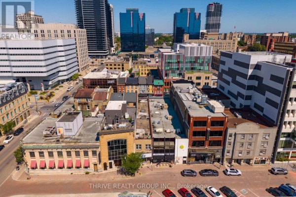 Aerial view of downtown London East with various commercial buildings and high-rises. - 119 Dundas Street, London East