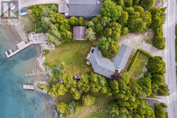 Aerial view of the property layout, showing buildings and surrounding trees. - 119 Pine Tree Harbour Road, Northern Bruce Peninsula