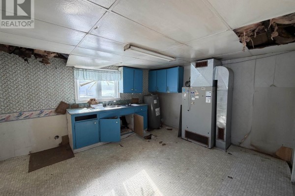 Narrow hallway with a door leading outside and a wall-mounted TV - 119 South Street, Donkin