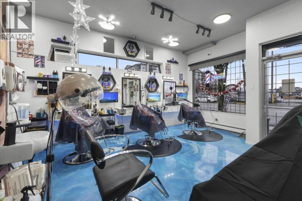 Aerial view of salon layout with furniture, workstations, and blue flooring - 11940 228 Street, Maple Ridge
