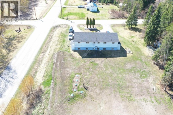 Aerial view of the multi-family property at 1195-1197 Omega Road, Quesnel. - 1195-1197 Omega Road, Quesnel