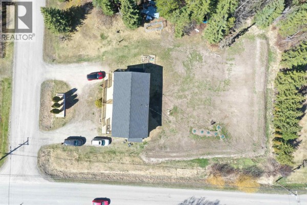 Overhead drone view of the duplex property and surrounding residential lot. - 1195-1197 Omega Road, Quesnel