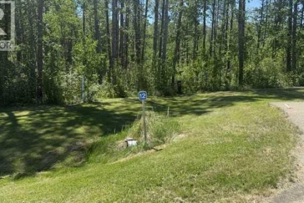 A decorative metal gate with wooden posts and a dark sign reading "The Properties of Eagles Quay". - 12, 2404 394 Township, Rural Lacombe County