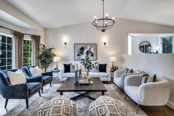 Dining area with bay windows, vaulted ceiling, and wood floors. - 12 A Invermere Pl, St  Albert