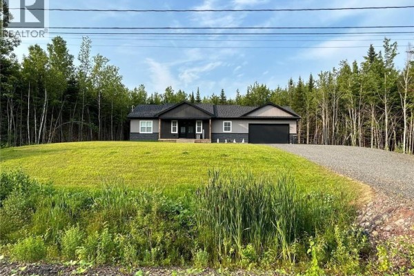 Back view of the house featuring a wooden deck and grassy yard with trees. - 12 Barbara Drive, Rusagonis Waasis