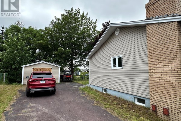 Laundry area with cabinetry and plumbing connections - 12 Cabot Street, Harbour Grace