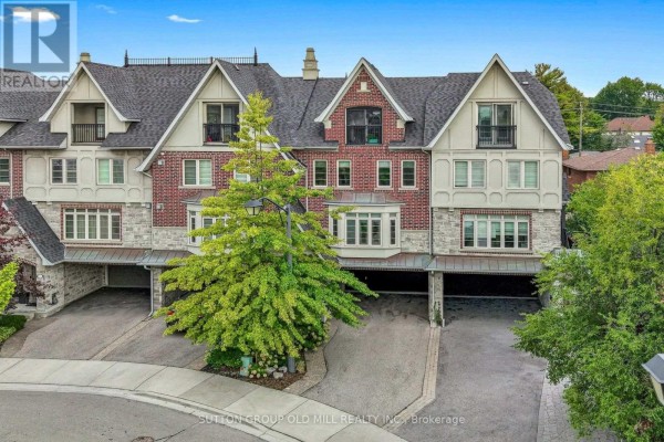Aerial view of townhouses with dark roofs, brick and stone facades. - 12 Gala Lane, Toronto