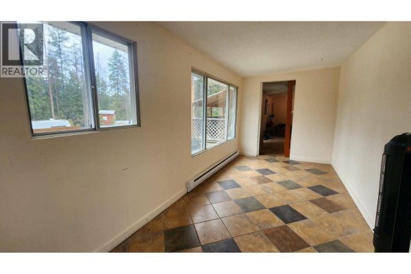 Interior room with light beige walls, a checkered tile floor, and two large windows. - 12 Specht Road, Cherryville