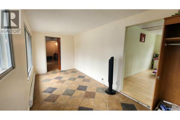 Interior room with light beige walls, a checkered tile floor, and doorways leading to other rooms. - 12 Specht Road, Cherryville