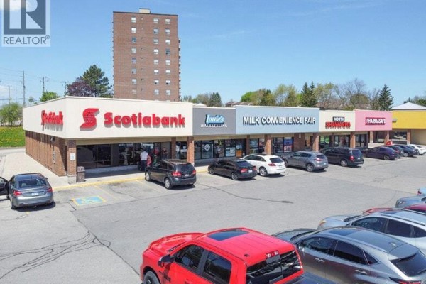 Street view of a commercial building with various businesses including Scotiabank. - 1200 Courtland Avenue Unit# 3, Kitchener