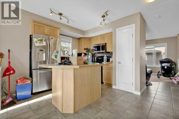 Living room - #1201, 2384 Sagewood Gate Sw, Airdrie, AB T4B0K7 Photo 5