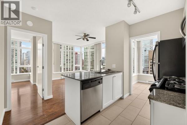 Concrete underground parking garage with marked spots, including spot 78, and parked cars. - 1201 480 Robson Street, Vancouver