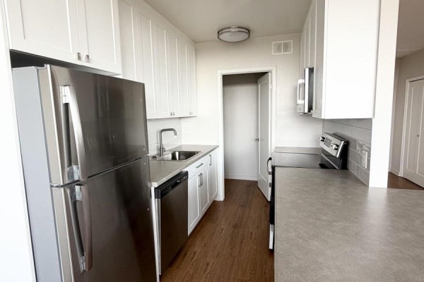 Kitchen with white cabinets, stainless steel refrigerator, dishwasher, and stove. - 1202 - 1209 Richmond Street, London East