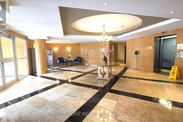 Lobby entrance with marble floors, elevator, and seating area. - 121 - 205 Bolton Street, Ottawa