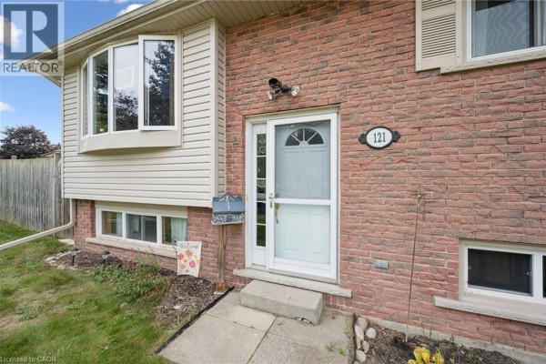 Close-up of the front entrance at 121 Nathaniel Crescent with brick facade. - 121 Nathaniel Crescent, Kitchener