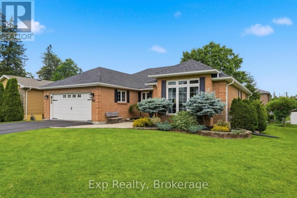 Aerial view of 121 Simcoe Street bungalow, surrounded by neighboring homes and green landscaping. - 121 Simcoe Street, Greater Napanee