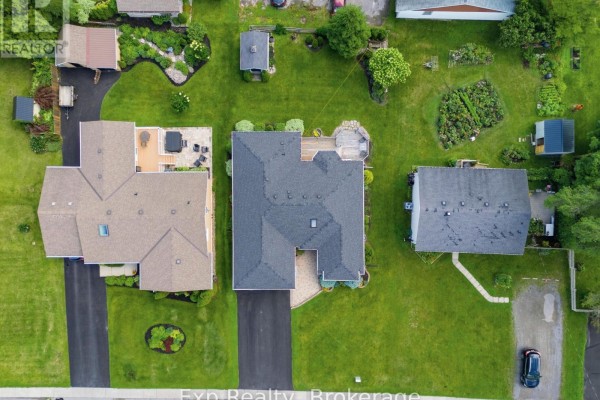 Aerial view of homes with yards, decks, hot tub, gardens, and sheds - 121 Simcoe Street Greater Napanee