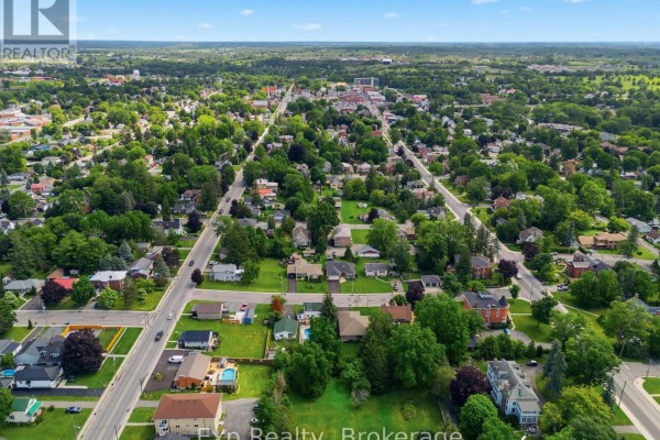 Aerial view of suburban neighborhood with houses and trees - 121 Simcoe Street Greater Napanee