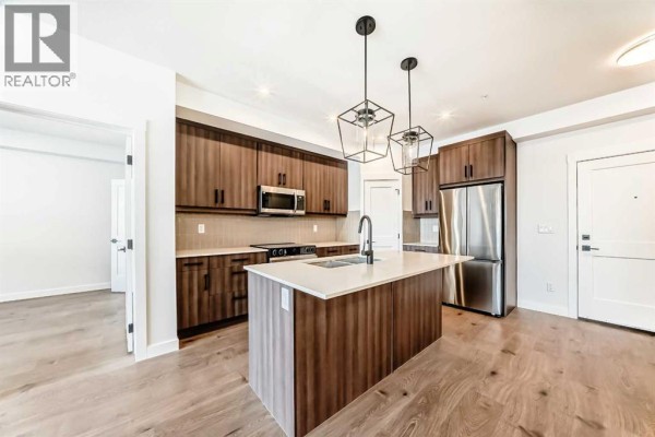 Living room - 1217, 14910 1 Street Nw, Calgary, AB T2C3G3 Photo 3