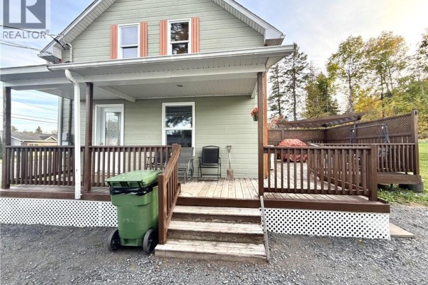 Close-up of a wooden deck and covered porch with steps leading to the house. - 1219 St-francois Street, Verret