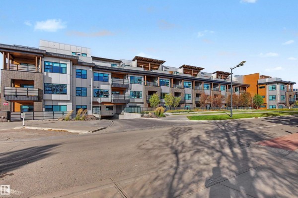 Exterior view of a modern multi-story apartment building with balconies and large windows. - #122 61 Festival Wy, Sherwood Park