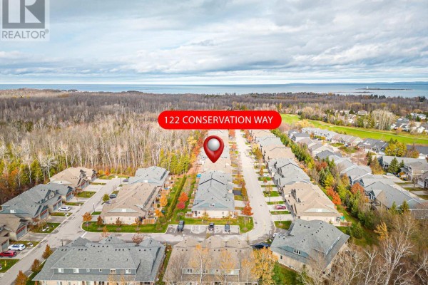 Aerial view of 122 Conservation Way neighborhood with forest and lake. - 122 Conservation Way, Collingwood