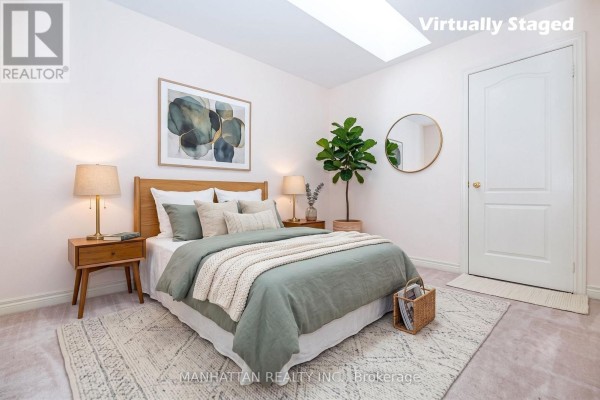 Kitchen with white cabinets, granite countertops, and a breakfast table. - 1220 Weston Road, Toronto