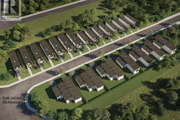 Overhead view of a housing development featuring compact modern homes with manicured lawns. - 12204 Westside Road Unit# 204, Vernon
