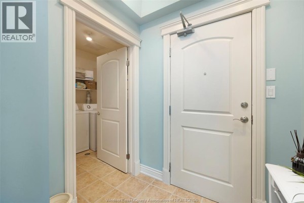Hallway with double doors and laundry closet - 1225 Riverside Unit# 409 Windsor