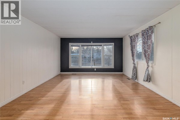 Interior entryway with tile flooring and built-in shelving unit - 123 Dogwood Street, Caronport