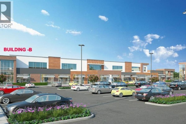 Rendering of Building -B, a commercial building with storefronts and a parking lot in front. - 1230, 76 Cornerstone Heights Ne, Calgary