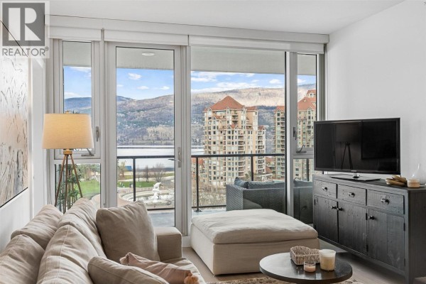 View from living room showing apartment buildings and Okanagan Lake. - 1232 Ellis Street Unit# 902, Kelowna