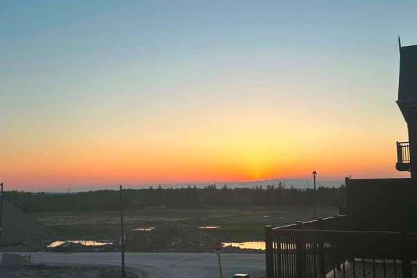 Horizon with a gradient sky from blue to yellow as the sun sets. - 12362 Mclaughlin Road, Caledon