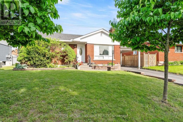 Backyard with a green lawn, white shed, soccer net, and wooden fencing. - 1237 Whitmore Avenue, Ottawa