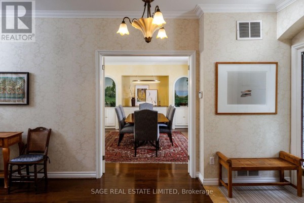 Dining room with table, chairs, built-ins, murals, and chandelier - 124 Blythwood Road Toronto
