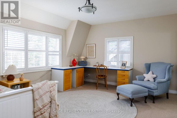 Bedroom with desk, armchair, and ottoman - 124 Blythwood Road Toronto