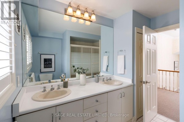 Double vanity bathroom with large mirror and shower stall - 124 Blythwood Road Toronto