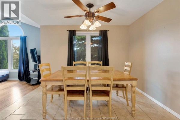 Wooden dining table and chairs with ceiling fan - 125 Queen Street South Tilbury