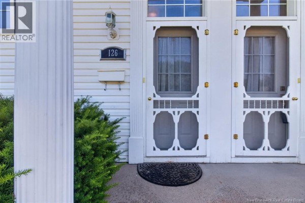 Close-up of the double front doors with decorative screens and house number 126. - 126 Bahama Street, Dieppe
