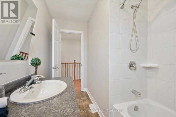 Bright bedroom with large windows and hardwood flooring - 126 Forfar Street E, Centre Wellington