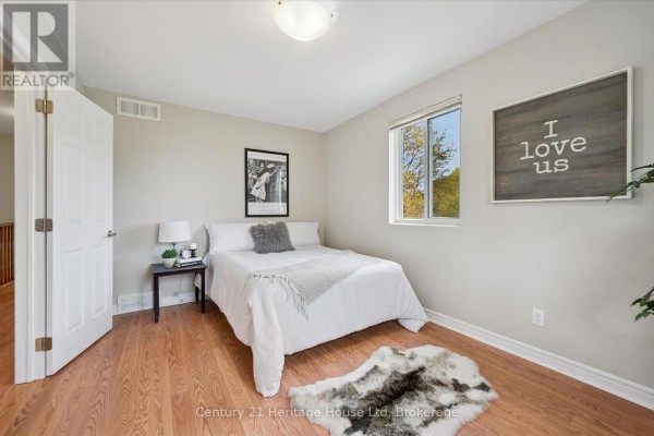 Exterior view of the two-story home with a landscaped yard - 126 Forfar Street E, Centre Wellington