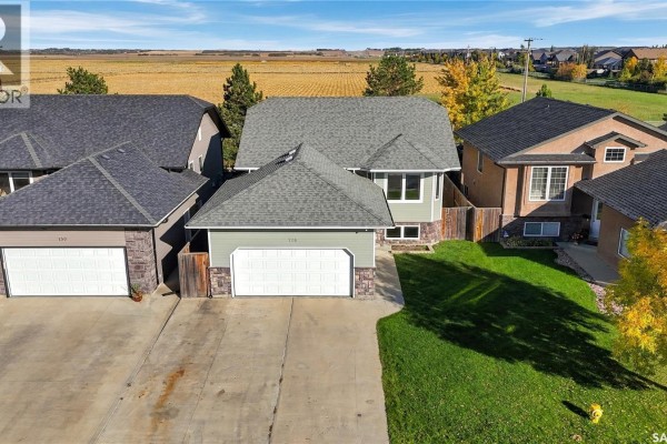 Aerial view of 126 Lamarsh Road, a residential house with a grey roof and lawn. - 126 Lamarsh Road, Saskatoon
