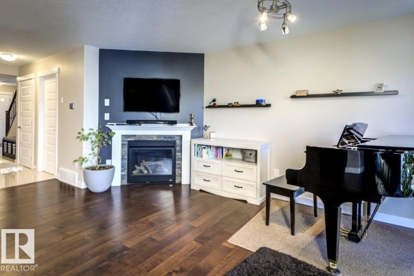 Family room - 126 Radcliffe Wd, Fort Saskatchewan, AB T8L0M6 Photo 4