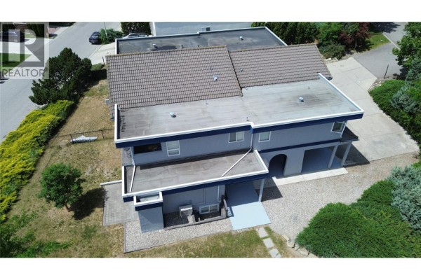Aerial view of the duplex exterior and surrounding landscape. - 126 Verna Court, Kelowna