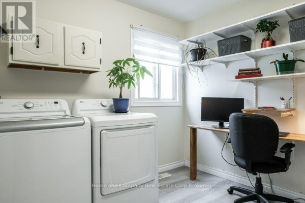 Floor plan with garage, kitchen, dining, primary bedroom, 2 beds, bath, laundry - 127 Walsh Crescent Stratford