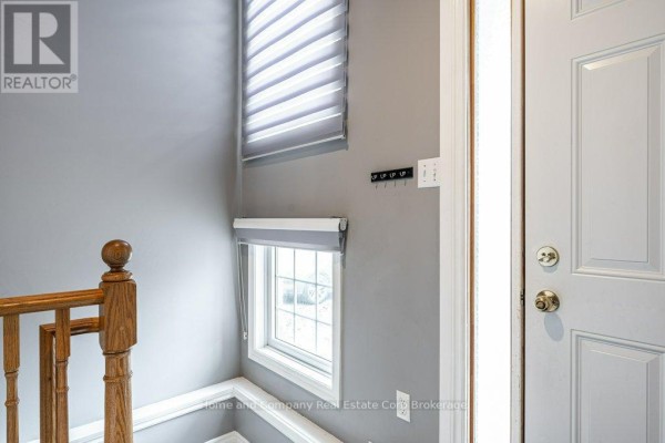 Desk with globe, chair, and lamp near a glass-pane door - 127 Walsh Crescent Stratford